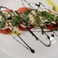 Halloumi · Grilled cypriot cheese served with tomato, onion, cucumber relish and citrus vinaigrette.