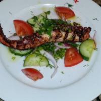 Grilled Octopus · Comes with capers, fava bean spread and raw onions.