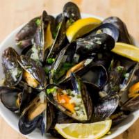 Steamed Mussels · Served with white wine sauce.