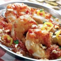 Shrimp Saganaki · Wild jumbo shrimp baked with tomato and feta cheese.