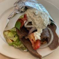 Gyro Sandwich Palatter · Served on a pita with lettuce, tomatoes, onions, and tzatziki sauce. Comes with small Greek ...
