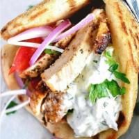 Chicken Souvlaki Sandwich · Served with lettuce and tomato, onions and tzatziki sauce.