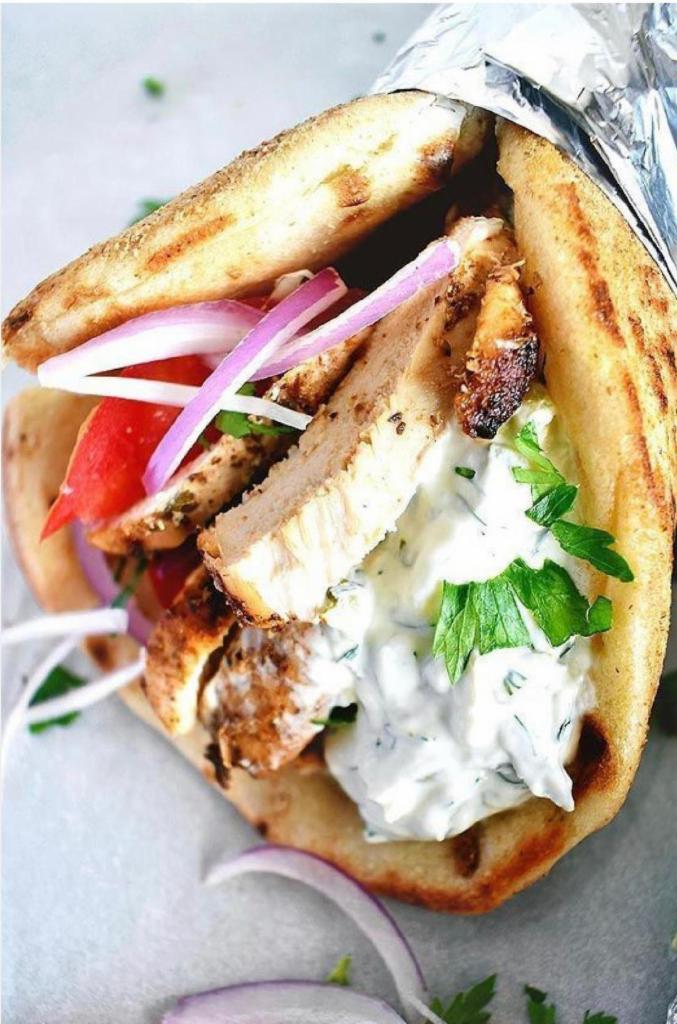 Combo Sandwich Platter · Mix of chicken and gyro. Served on a pita with lettuce, tomatoes, onions, and tzatziki sauce. Comes with small Greek salad, pita bread, tzatziki sauce and french fries.