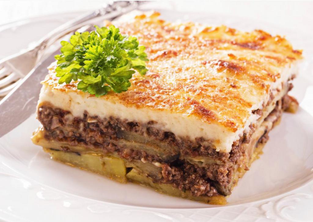 Moussaka · Layers of potatoes, grilled eggplant, zucchini and ground beef, topped with Bechamel sauce. Served with salad.