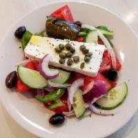 Horiatiki Salad · Traditional Greek village salad. Local farm steak tomatoes, cucumbers, onions, green peppers...