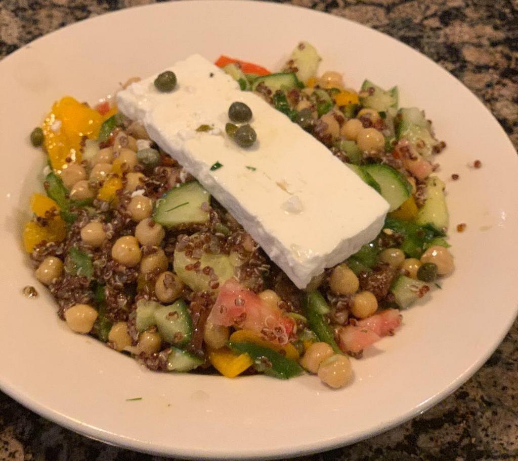 Mediterranean Quinoa Salad · Organic chickpeas, peppers, cucumbers, local farm steak tomatoes, dill, scallions, Dodonis feta cheese, capers, extra virgin olive oil and vinegar.