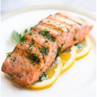 Solomos · Grilled Norwegian salmon on a bed of leek and rice with saffron lemon sauce.