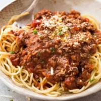 Pasta Bolognese · Served with choice of pasta, salad, bread and butter and Romano cheese.