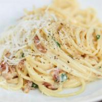Fettuccine Carbonara · Served with salad, bread and butter and Romano cheese.