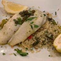Flounder Filet · Broiled and topped with lemon vinaigrette sauce and leek rice.