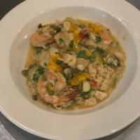 Shrimp and Scallops Scampi · Sauteed in garlic-capers-wine sauce. Served over leek rice.