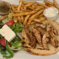 Chicken Souvlaki  Sandwich Deluxe · greek salad, french fries, and tzatziki