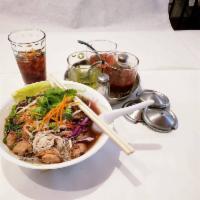 Thai Boat Noodle Soup · Thai style noodle soup with tender pork spare rib or sliced beef, meat balls, beansprouts, C...