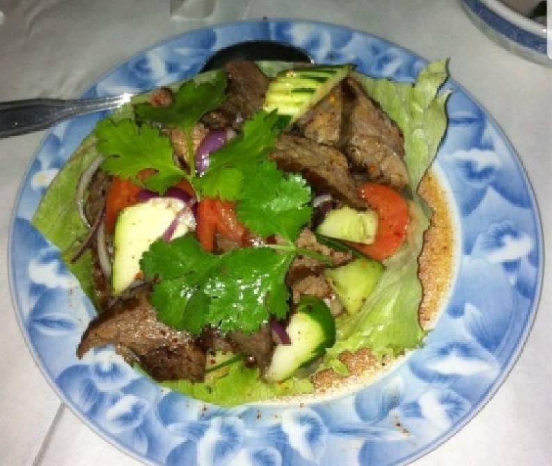 Beef Salad · Yum Nua. Sliced BBQ beef mixed with chili, onions, tomatoes and cucumbers in spicy lime dressing. Spicy.