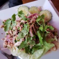 Larb · Choice of beef, pork or chicken mixed with roasted rice powder, red onions, mint leaves and ...