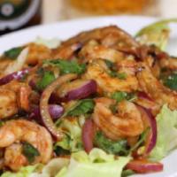 Shrimp Salad · Grilled shrimp mixed with chili paste and onions, tomatoes, sliced lemon grass and sliced ka...