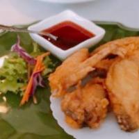 Fried Chicken Wings · Deep fried marinated wings served with sweet and sour sauce. (5 Pieces)