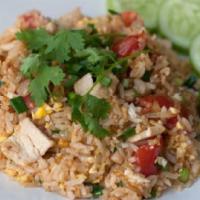 Fried Rice · Stir fried choice of meats with jasmine rice, onions, scallions, carrots, green peas and egg.