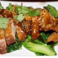 Tamarind Duck · Deep fried duck topped with tasty tamarind sauce. Served with ginger and steamed mixed veget...