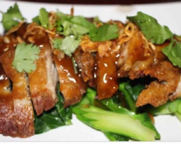Tamarind Duck · Deep fried duck topped with tasty tamarind sauce. Served with ginger and steamed mixed vegetables.
