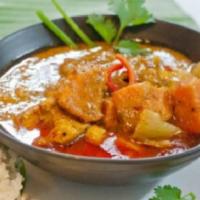 Massaman Curry · Choice of meat in massaman curry paste, coconut milk, onions, cashew nuts and potatoes. Spicy.