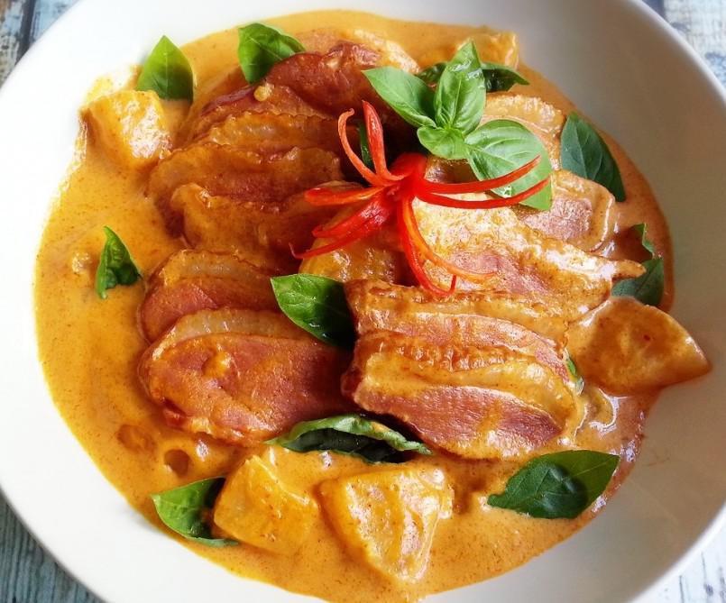 Thai Duck Curry · Deep fried duck in red curry sauce, coconut milk, basil leaves, bamboo shoot, bell pepper, and pineapple.