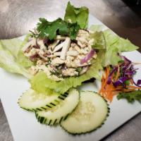 Larb Tofu · Cooked minced tofu, mushroom, mixed with roasted rice power, red onions, mint leaves and sca...