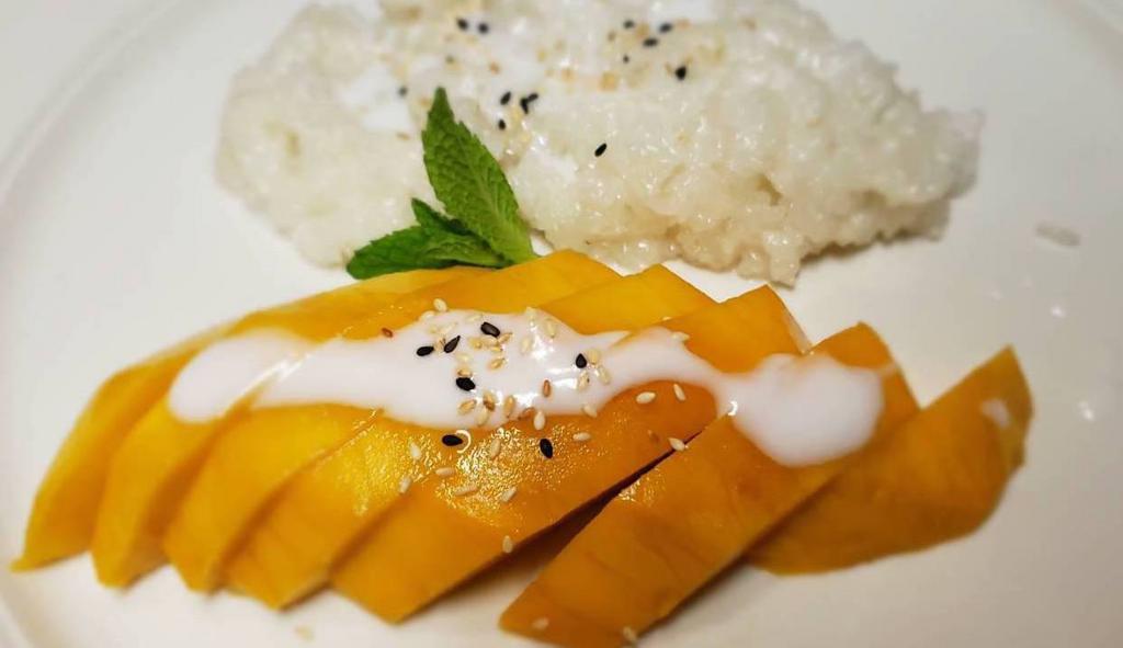 Mango Sticky Rice · Sweet coconut sticky rice with sweet mango topped with coconut milk.
