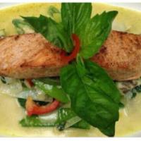 Pan Seared Salmon · Salmon in green curry, coconut milk, basil leaves, bamboo shoots, bell peppers and steamed v...