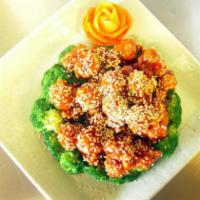 Sesame Chicken · Chunks of chicken fried crispy in sauce. Served with sesame seeds on a bed of broccoli. Serv...