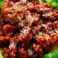 Sesame Beef · Chunks of beef fried crispy in sauce. Served with sesame seeds on a bed of broccoli. Served ...