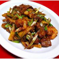Triple Delight with Scallion · A combination of sliced chicken, beef and jumbo shrimp sauteed with scallion in chef's brown...