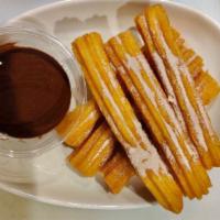 Churros · Mexican style donuts with cinnamon and sugar served with chocolate sauce
