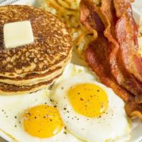 The Lumberjack · Two eggs, bacon or sausage, hash browns, and a short stack of pancakes.