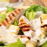 Caesar salad with grilled chicken · Crispy or grilled chicken breast mixed with romaine lettuce, parmesan cheese, and croutons.