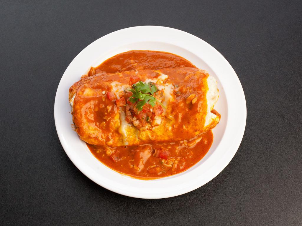 Wet Burrito · A flour tortilla filled with rice, beans, salsa, sour cream, cheese and your choice of meat. Smothered in our traditional salsa Roja and topped with cheese and pico de gallo. Prawns or fish for an additional charge.