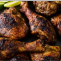 Jerk Chicken Special  · Jerk chicken served with rice and peas, cabbage and your choice of a Can soda or bottle of w...