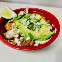 Fish Bowl · Beer battered fish on a bed of Spanish rice topped with fresh lettuce, cabbage, tomato, onio...