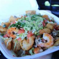 Surf N Turf Loaded Fries · Grilled Shrimp and Steak on a bed of Crispy French Fries. Topped with Mozzarella Cheese, Fre...