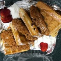 Moe's Chicken & Waffles · Crispy chicken breast served with delicious golden brown waffles and buttery syrup. Yummie!