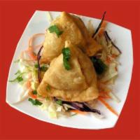 2 Piece Vegetable Samosa · Potato and peas stuffed in a savory pastry. Vegetarian.