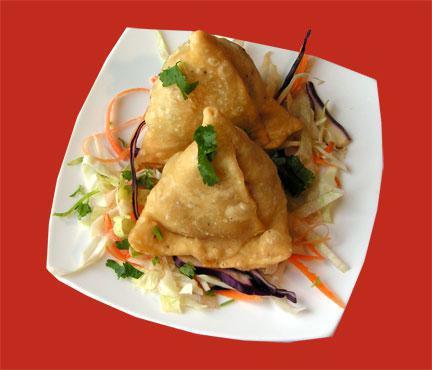 2 Pieces Vegetable Samosa · Potato and peas stuffed in a savory pastry.
