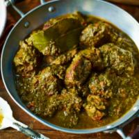 Lamb Saag · Succulent lamb chunks simmered in aromatic spinach and onion sauce.