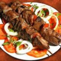 Lamb Boti Kebab · Saffron marinated select chunks of lamb marinated and grilled to perfection in tandoor.