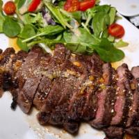 Crying Tiger Steak · New York strip steak, salad, nam jim jaew.