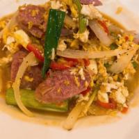 Pad Nam · Stir fried fermented sausage, with scrambled eggs, onions, peppers, and scallions.