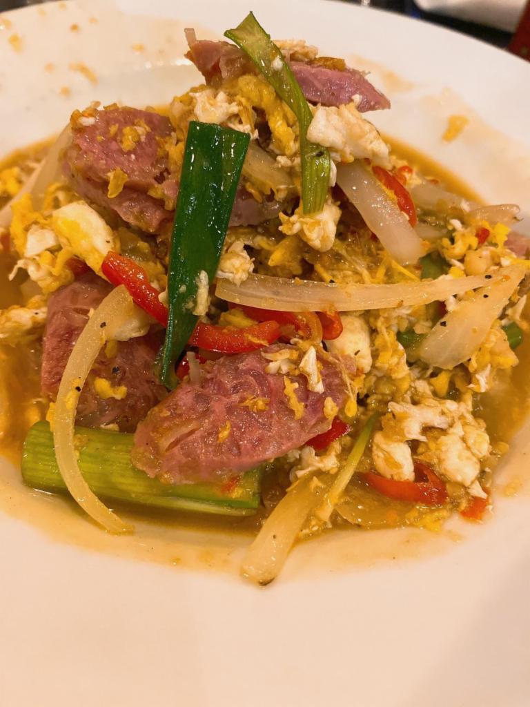 Pad Nam · Stir fried fermented sausage, with scrambled eggs, onions, peppers, and scallions.