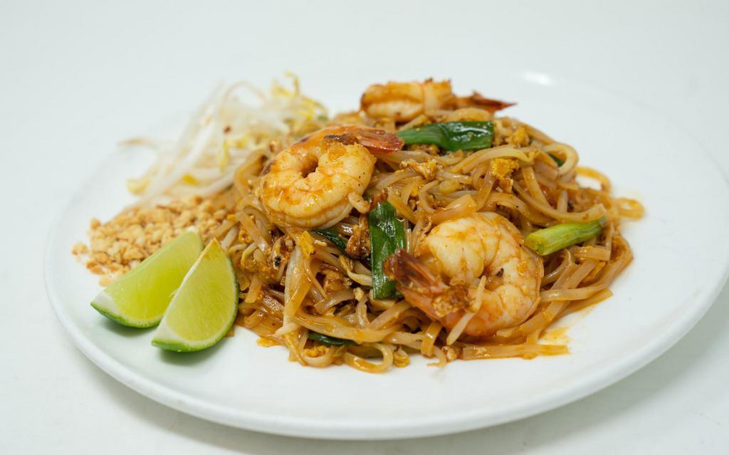 Pad thai · Thin rice noodles, tofu, egg, chives, peanuts, tamarind sauce. 