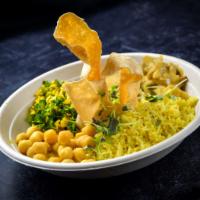 Sri Lankan Buddha Bowl · Yellow basmati rice, chick pea curry, seitan curry, coconut kale and crispy papadum.