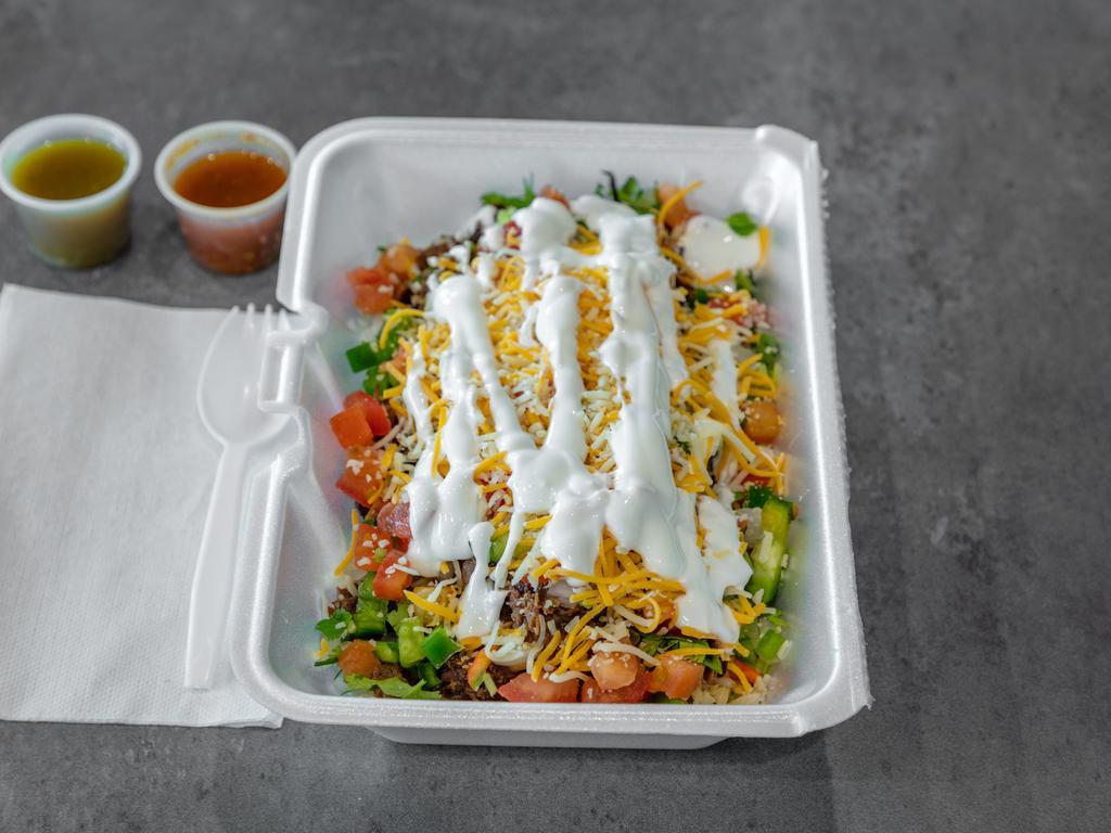 Burrito Bowl · Served with choice of meat, rice, refried beans, onion, cilantro, lettuce, tomato, cheese, sour cream, and diced jalapenos.